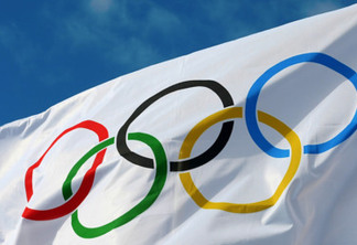 ATHENS, GREECE- OCTOBER 2, 2013: White Olympics Flag against the blue sky in Athens, Greece.