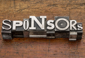 sponsors word in mixed vintage metal type printing blocks over grunge wood