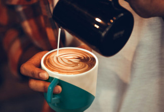 Coffee workshop barista make a Coffee latte art Selective focus white cup.color vintage style.; Shutterstock ID 1107097526; BDC (n° only): -; Client: –