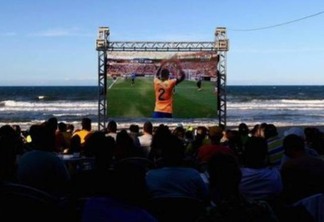 Fans watch the FIFA Confederations Cup, first semi final match between Brazil and Uruguay, on Praia Futuro on June 26, 2013 in Fortaleza, Brazil.